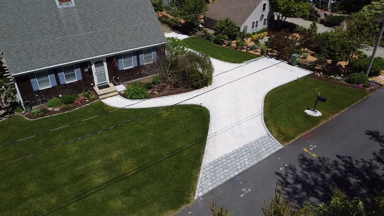 Aerial view of driveway and landscaped yard