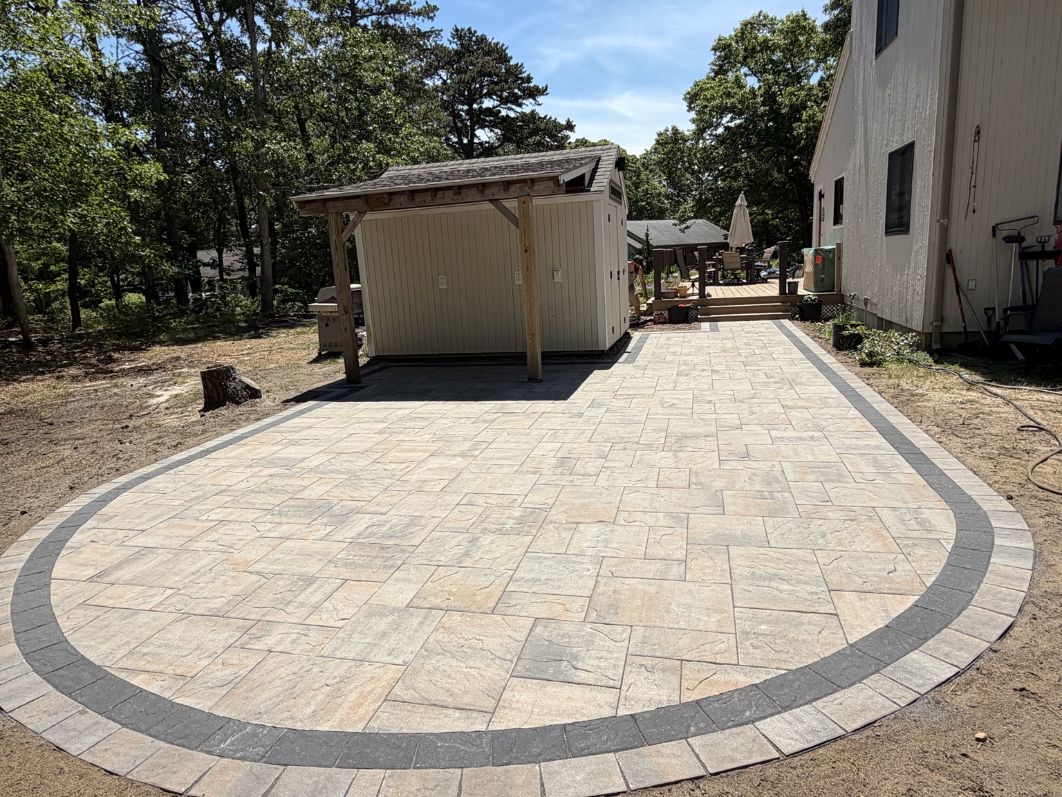 Expansive curved paver patio